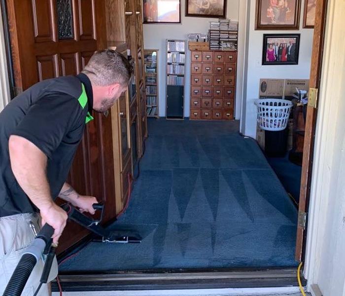 Our technician cleaning the foyer of a home