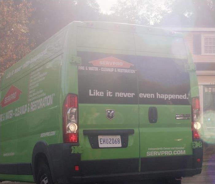 SERVPRO of Van Nuys South's green work van with SERVPRO logo at clean up site