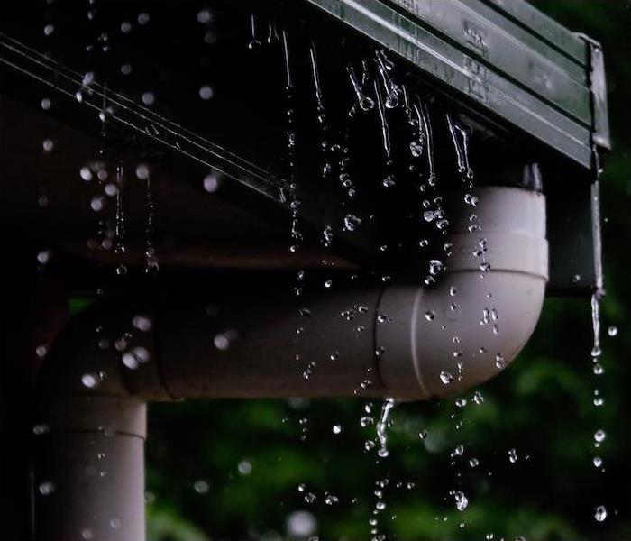 water falling from a sink due to a clogged drain